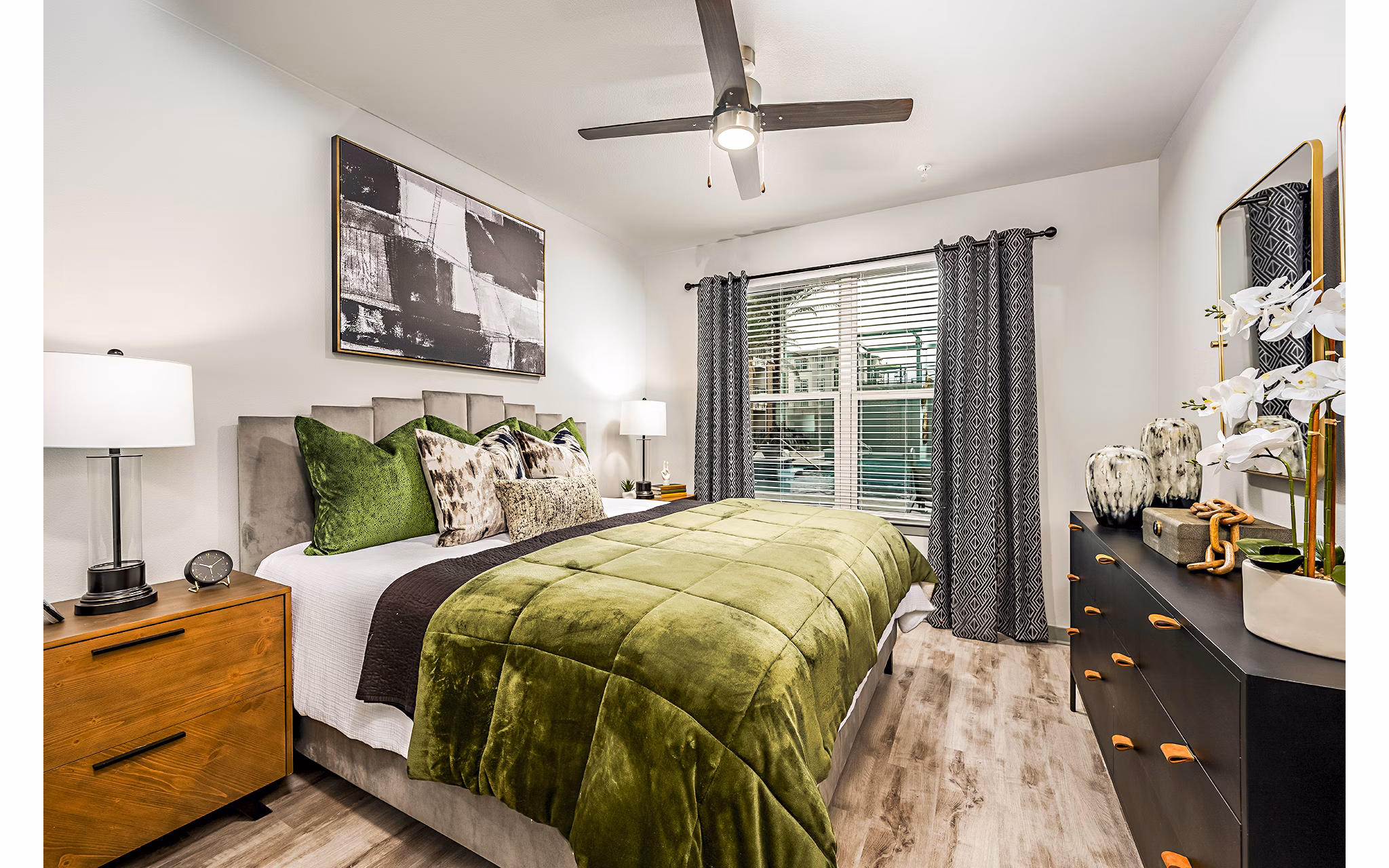 Spacious bedroom with elegant decor at The Aston at Town Center Apartments