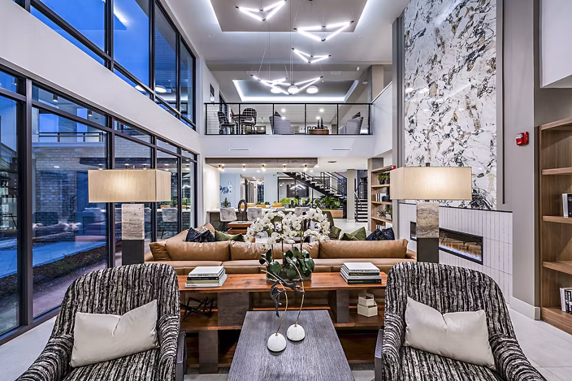 Clubhouse featuring elegant design and lounge seating at The Aston at Town Center Apartments