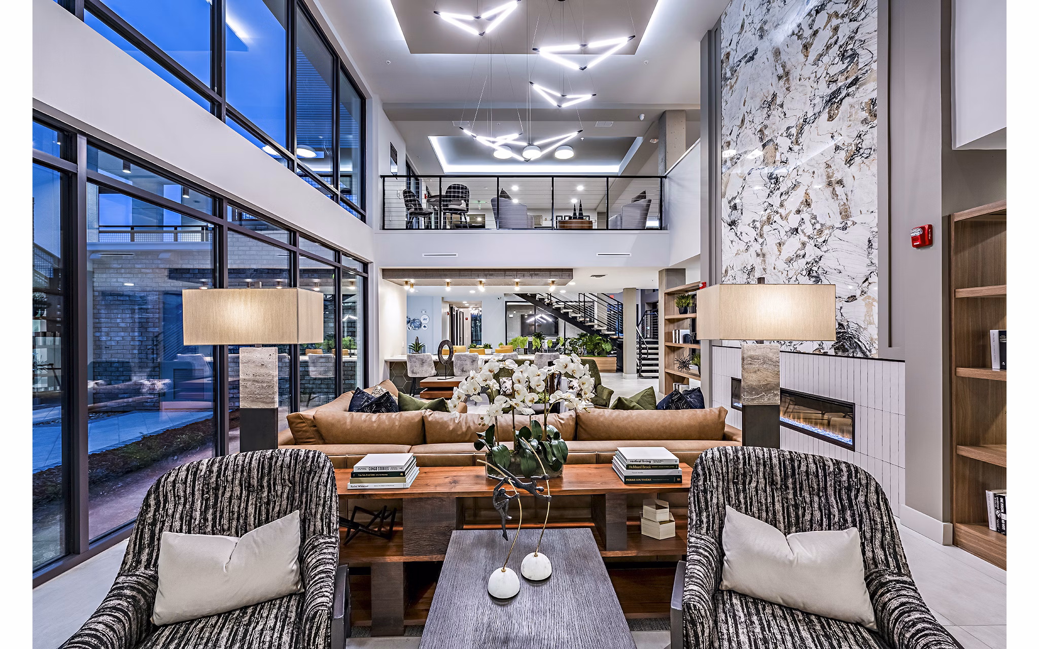 Clubhouse featuring elegant design and lounge seating at The Aston at Town Center Apartments