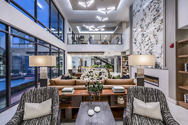 Clubhouse featuring elegant design and lounge seating at The Aston at Town Center Apartments