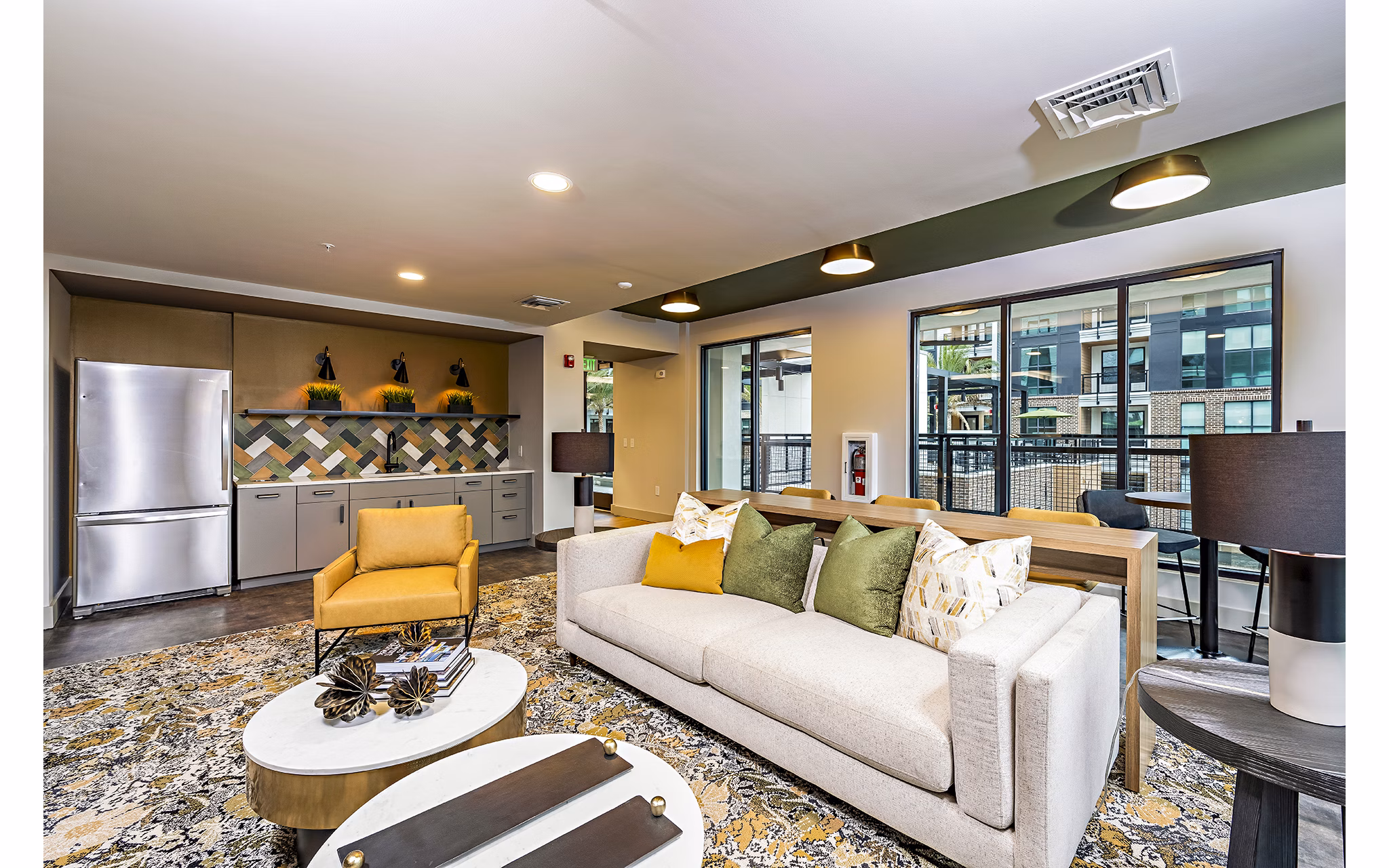 Clubhouse with modern design and comfortable seating at The Aston at Town Center Apartments, featuring elegant interiors for social gatherings