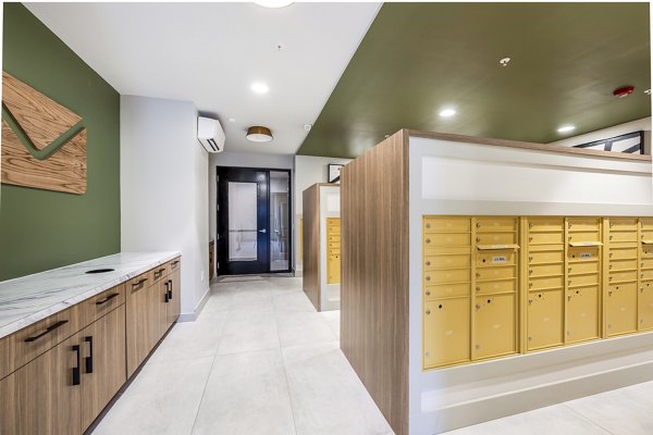 Clubhouse mail room featuring organized mailboxes at The Aston at Town Center Apartments