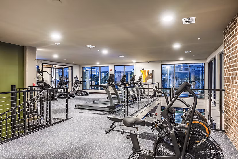 Fitness center featuring state-of-the-art equipment at The Aston at Town Center Apartments