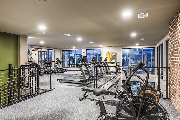 Fitness center featuring state-of-the-art equipment at The Aston at Town Center Apartments