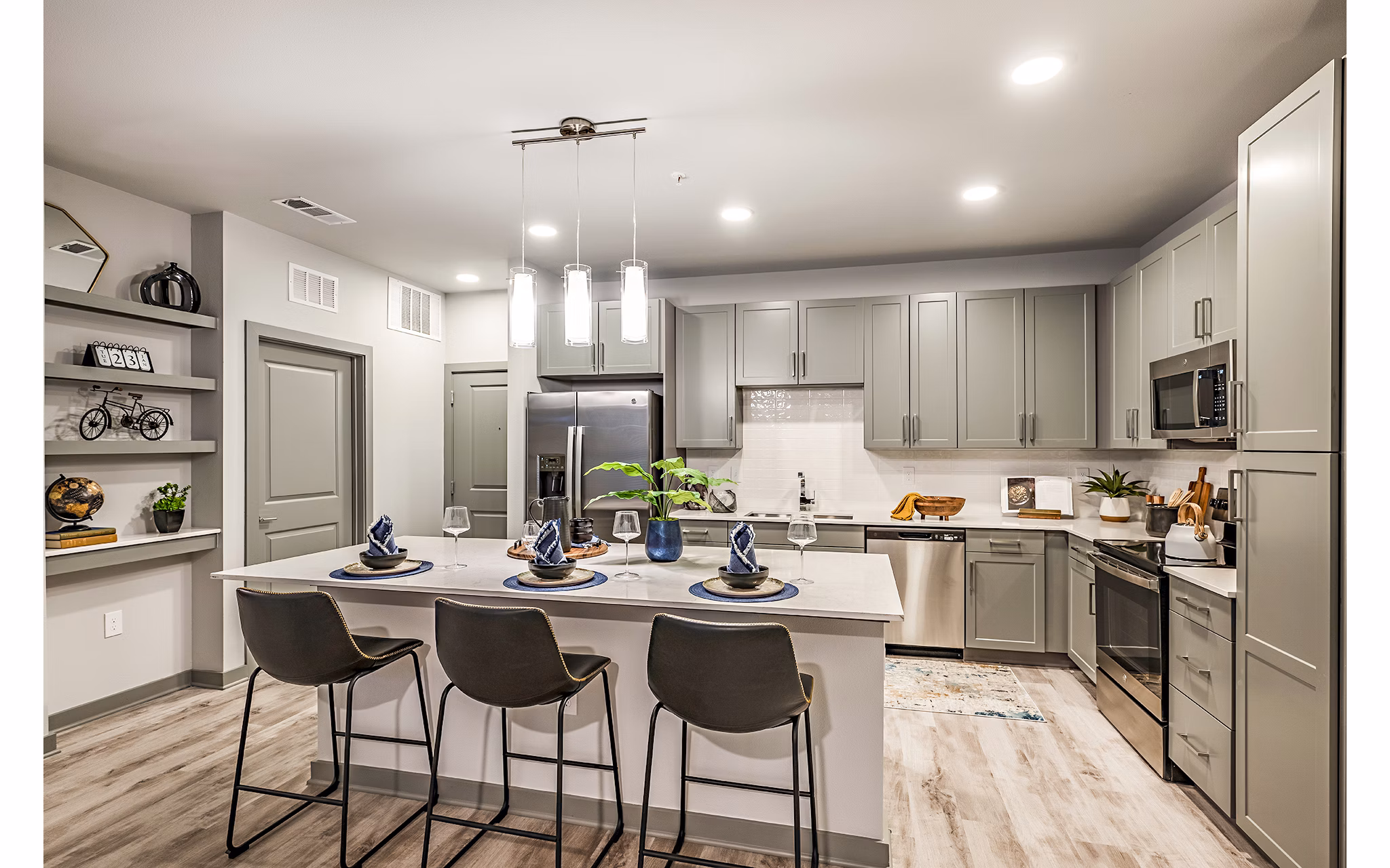 Modern kitchen featuring sleek countertops and stainless steel appliances at The Aston at Town Center Apartments