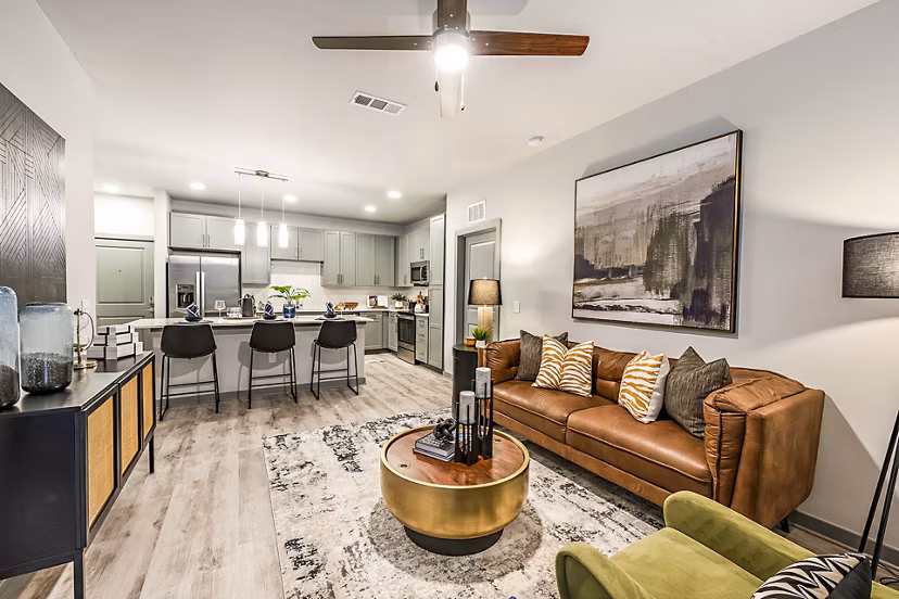 Modern living room with sleek furnishings at The Aston at Town Center Apartments, offering luxury living in the heart of a vibrant community