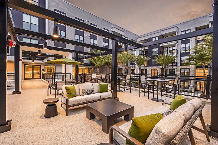 Patio with modern furnishings at The Aston at Town Center Apartments offering luxurious outdoor relaxation spaces