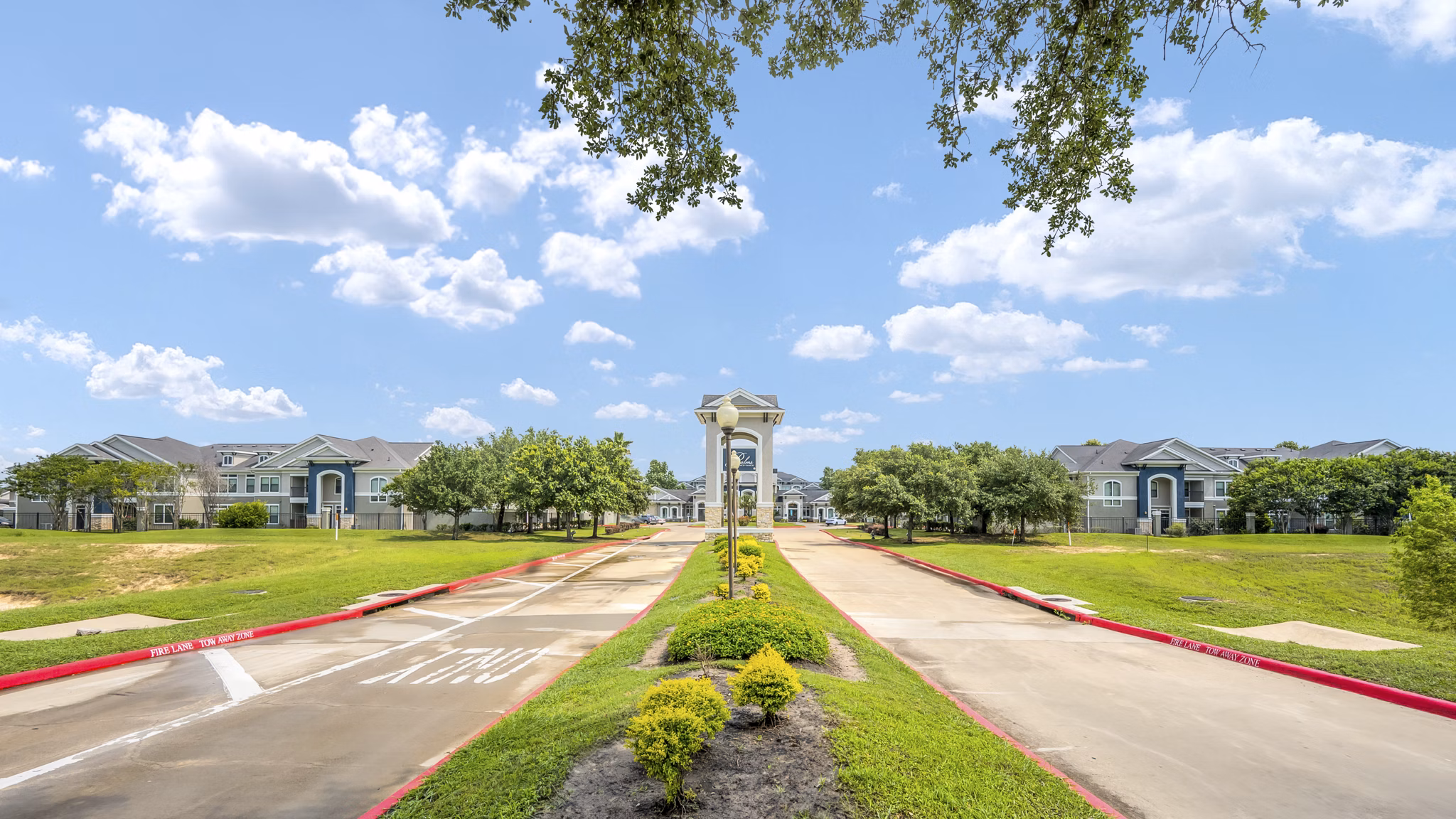 building/exterior at Palms at Cinco Ranch Apartments