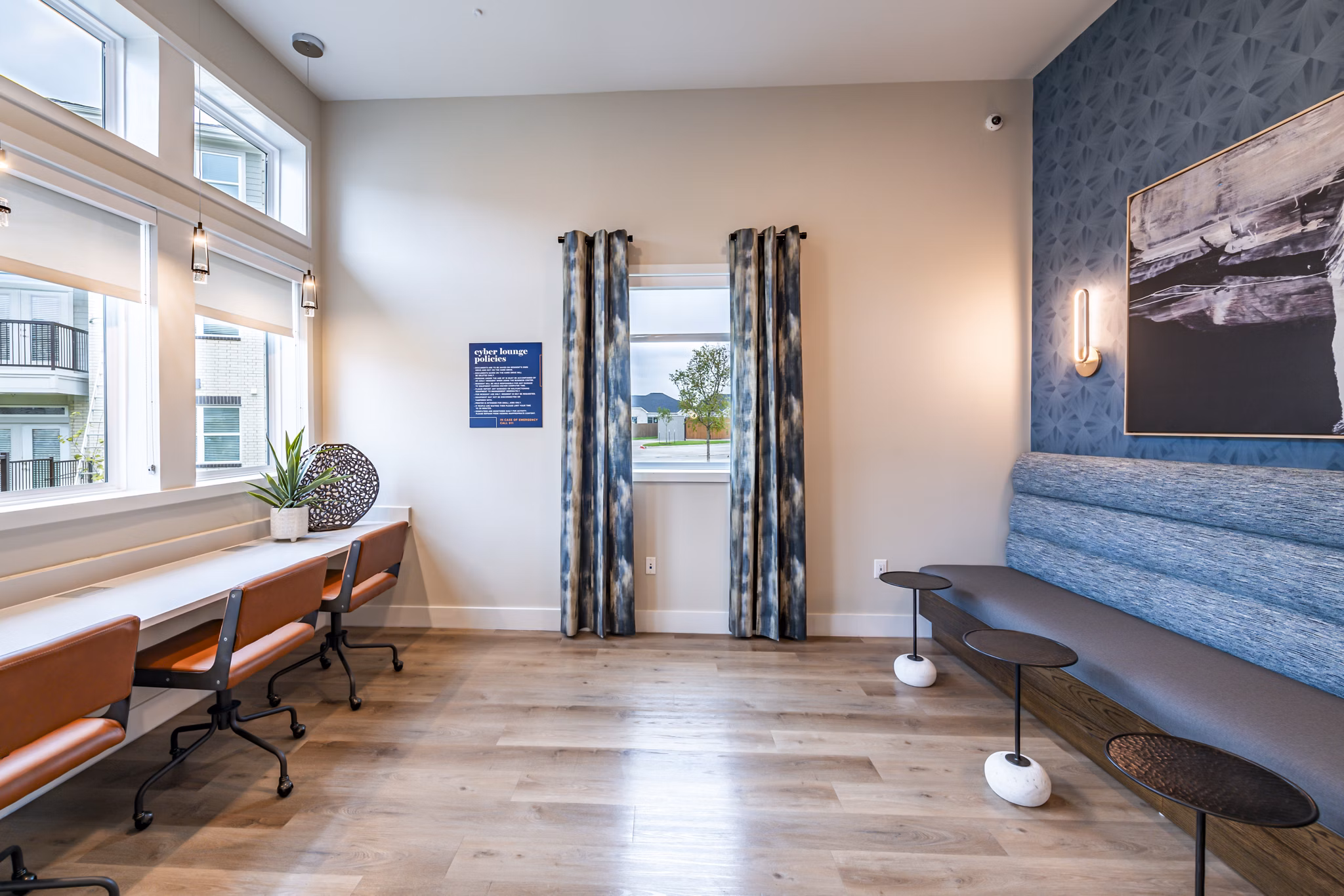 Clubhouse business center with modern workstations at Prose Stoneridge Apartments, ideal for remote work and meetings