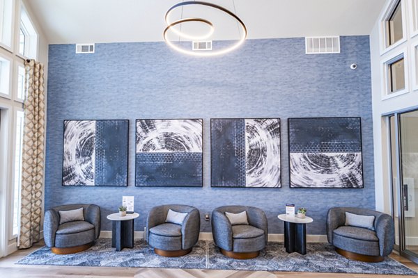 Clubhouse featuring contemporary design and pool table at Prose Stoneridge Apartments in a luxury setting