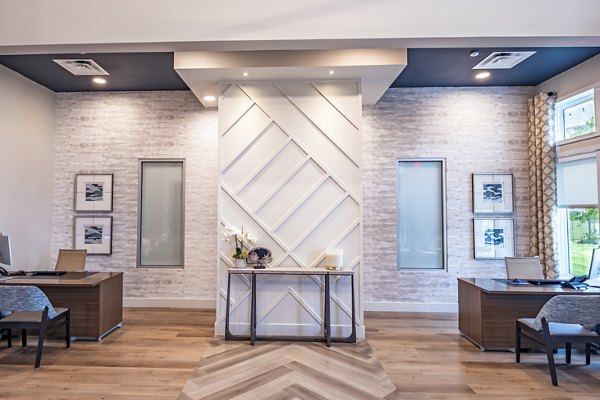 Clubhouse featuring modern design and cozy seating at Prose Stoneridge Apartments