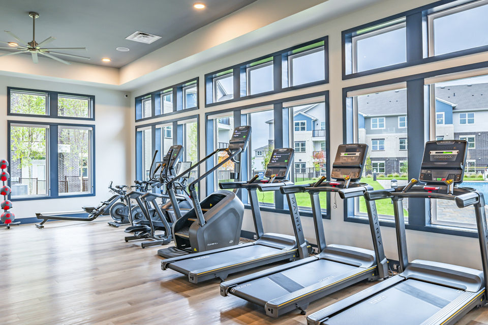Modern fitness center with state-of-the-art equipment at Prose Stoneridge Apartments