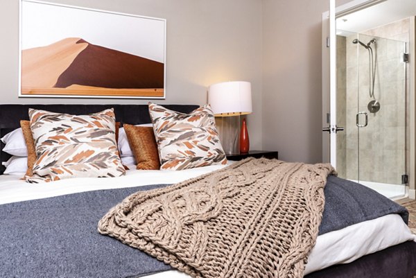 Bedroom featuring elegant decor and natural light in Avenida Palm Desert Apartments