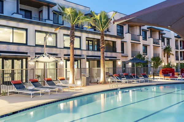 Resort-style pool area at Avenida Palm Desert Apartments offering relaxation and leisure amenities