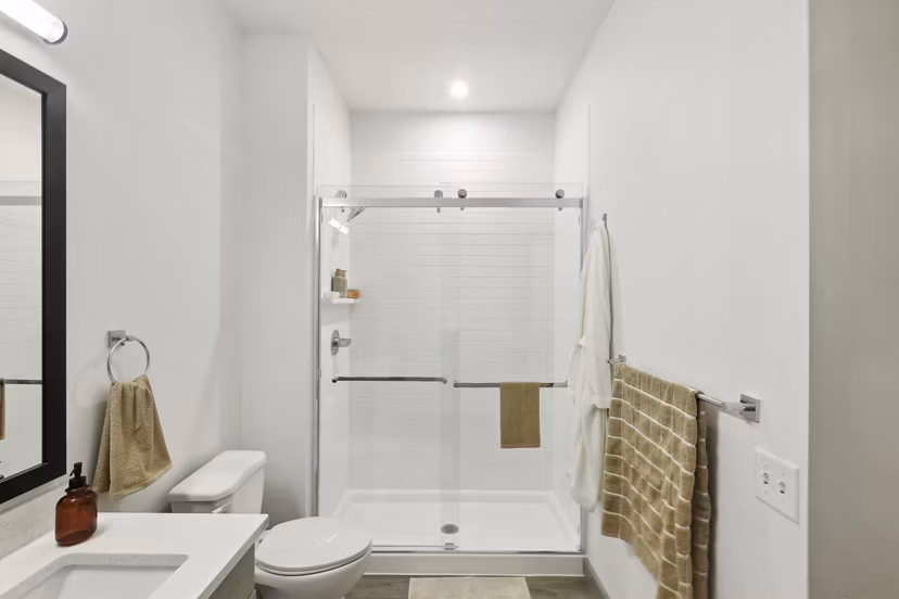 Elegant bathroom with marble countertops at The Foundmore Apartments, a luxury apartment community by