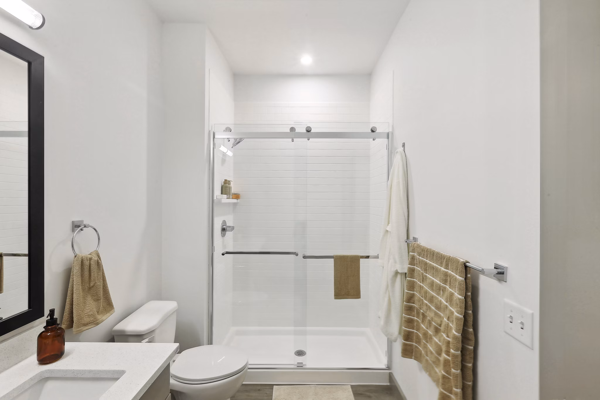 Elegant bathroom with marble countertops at The Foundmore Apartments, a luxury apartment community by