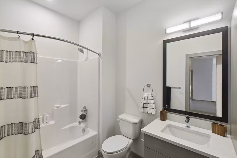 Contemporary bathroom with sleek fixtures at The Foundmore Apartments