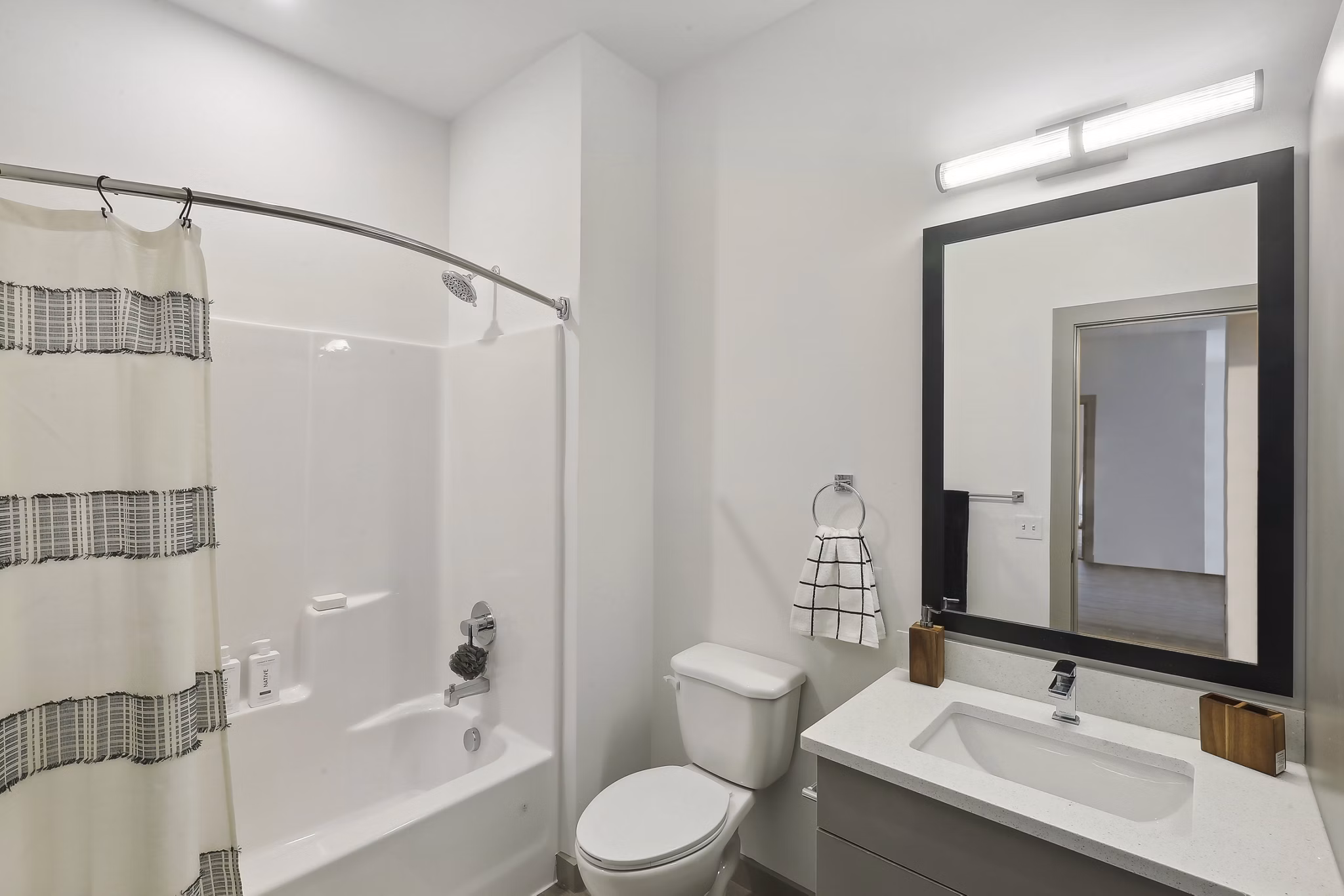 Contemporary bathroom with sleek fixtures at The Foundmore Apartments
