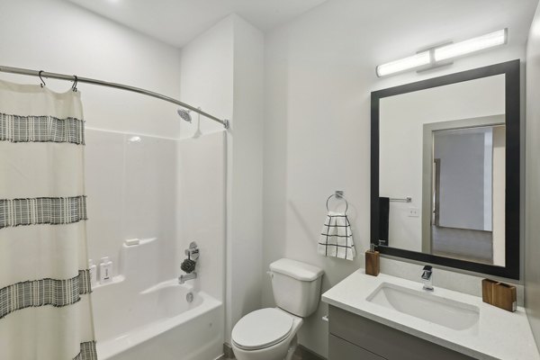 Contemporary bathroom with sleek fixtures at The Foundmore Apartments