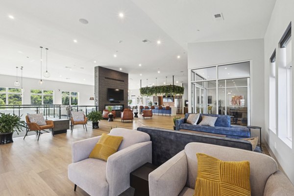 Modern clubhouse with upscale seating and entertainment options at The Foundmore Apartments luxury community