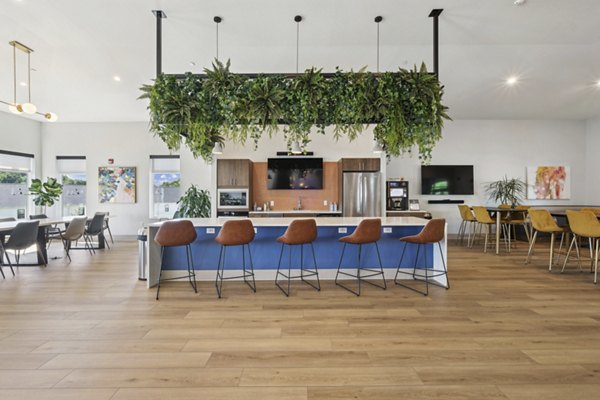 Spacious clubhouse with modern furnishings at The Foundmore Apartments