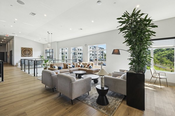 Clubhouse featuring sleek design and modern furnishings at The Foundmore Apartments