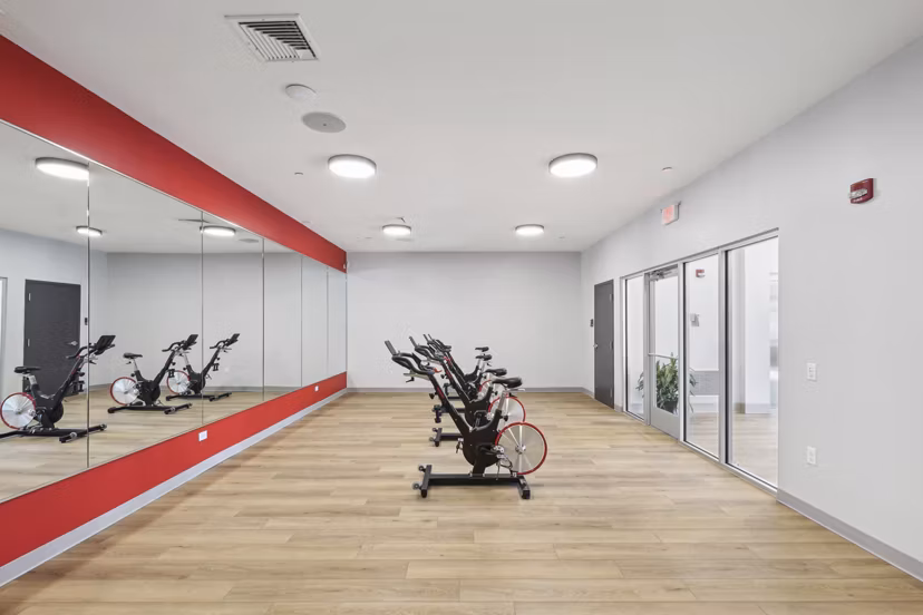 Yoga and spin studio with modern equipment at The Foundmore Apartments