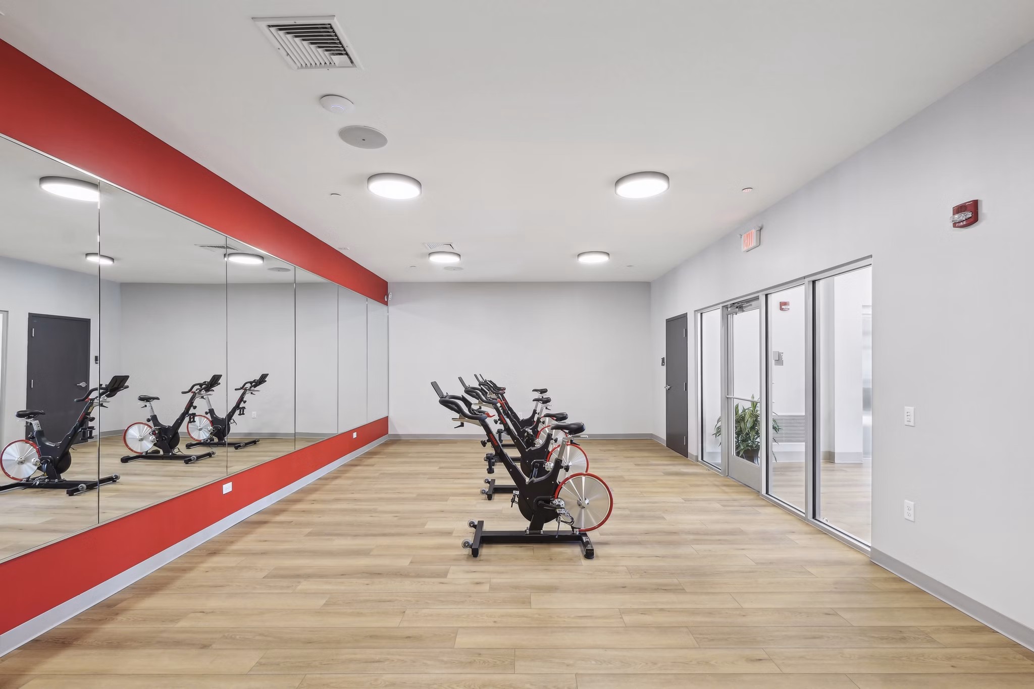 Yoga and spin studio with modern equipment at The Foundmore Apartments