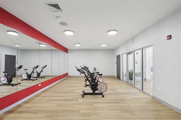Yoga and spin studio with modern equipment at The Foundmore Apartments