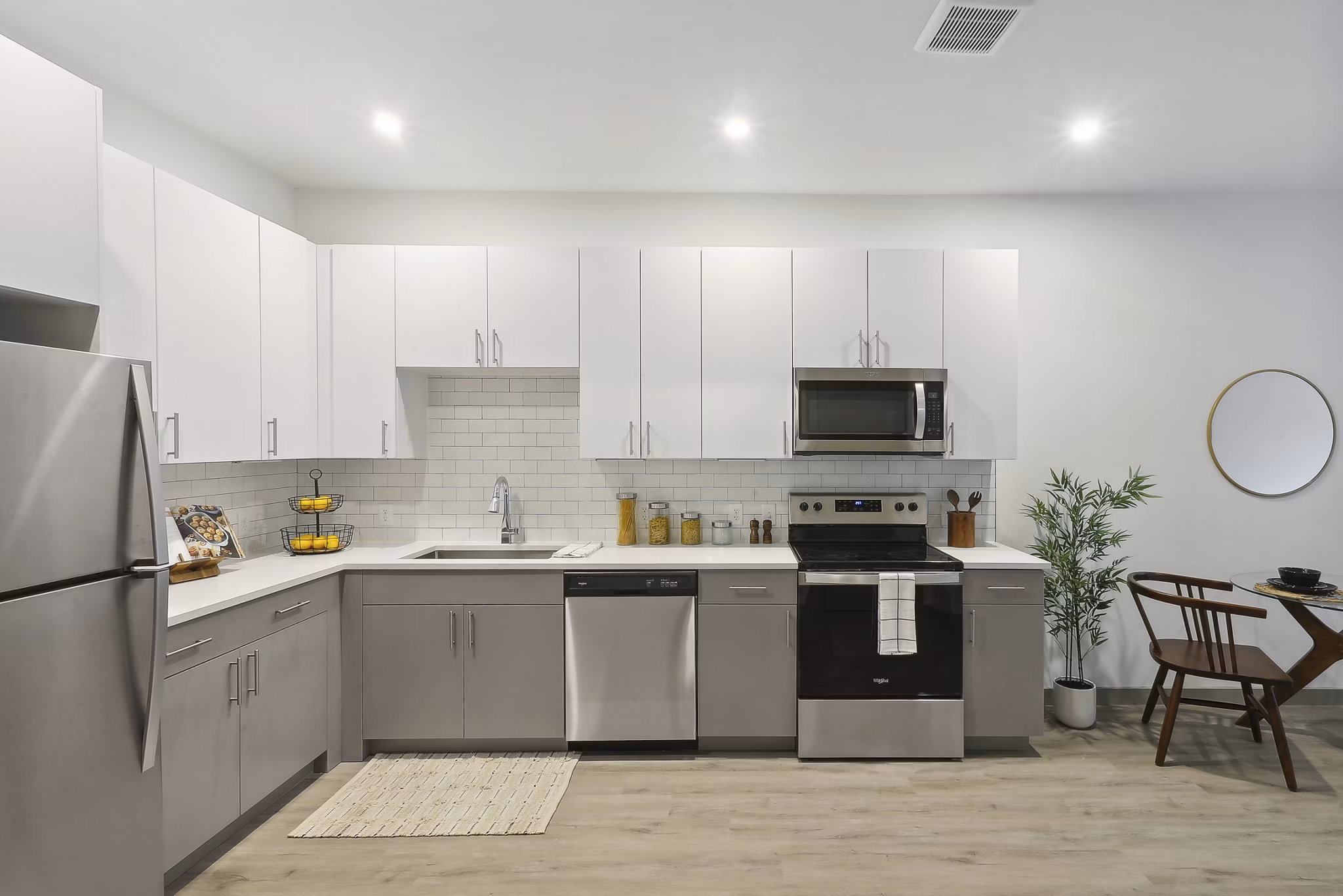 Modern kitchen with stainless steel appliances at The Foundmore Apartments