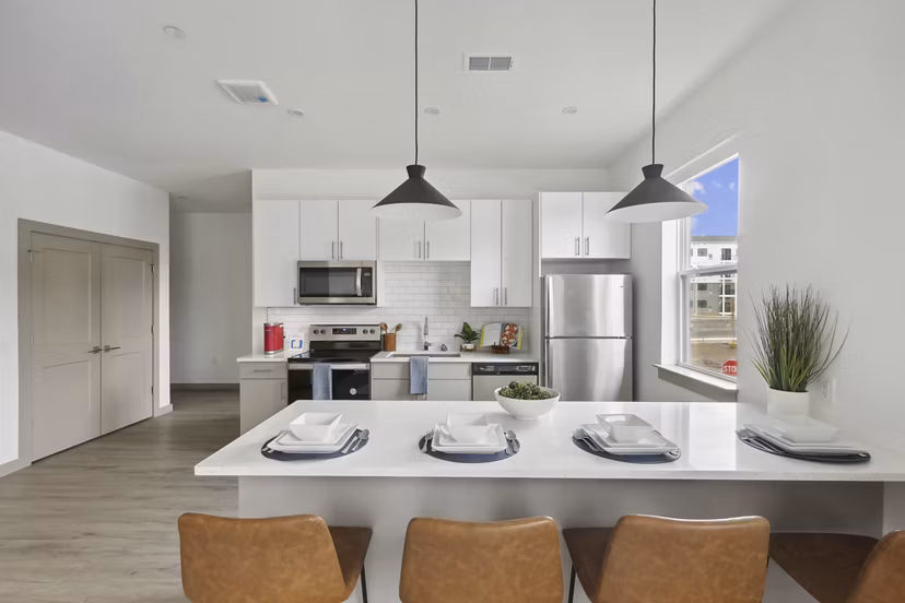 Modern kitchen with sleek countertops and stainless steel appliances at The Foundmore Apartments