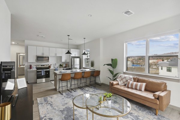 Spacious living room with modern decor at The Foundmore Apartments