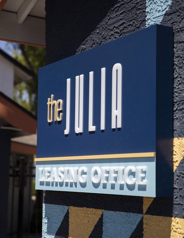 The Julia Apartments: Elegant building signage in upscale neighborhood