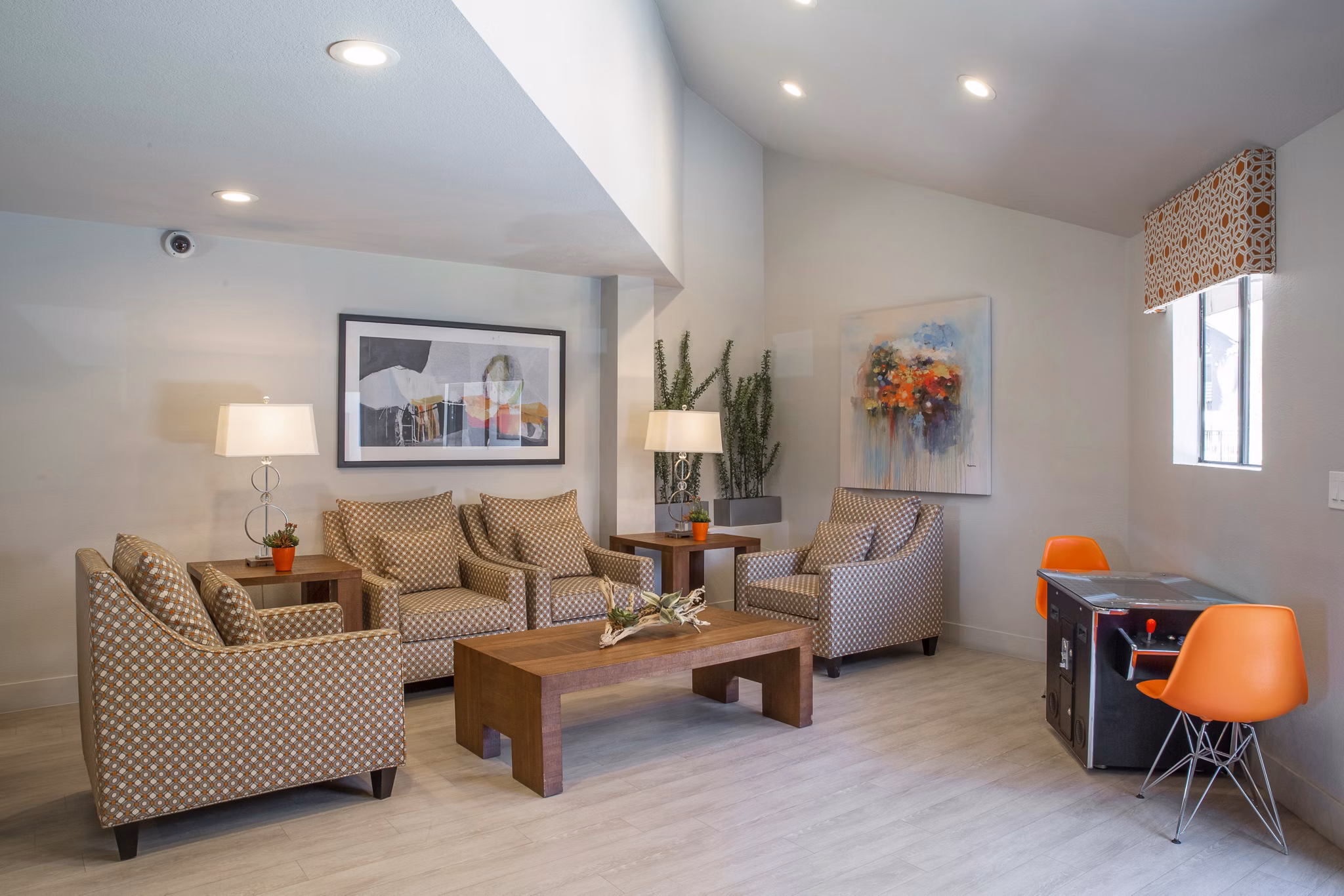 Clubhouse at The Julia Apartments: Modern communal space with plush seating and open layout for luxury living in Greystar's upscale community