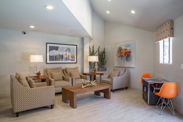 Clubhouse at The Julia Apartments: Modern communal space with plush seating and open layout for luxury living in Greystar's upscale community