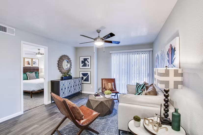 Modern living room with stylish furniture and a view into the bedroom in luxury apartments