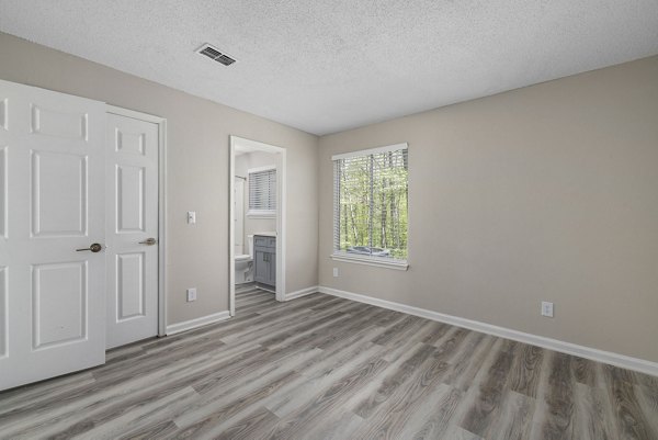 Spacious bedroom with natural light at Madison at Adams Farm Apartments