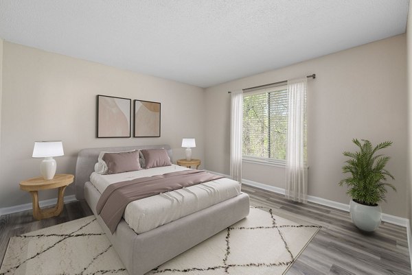 Cozy bedroom with modern decor at Madison at Adams Farm Apartments
