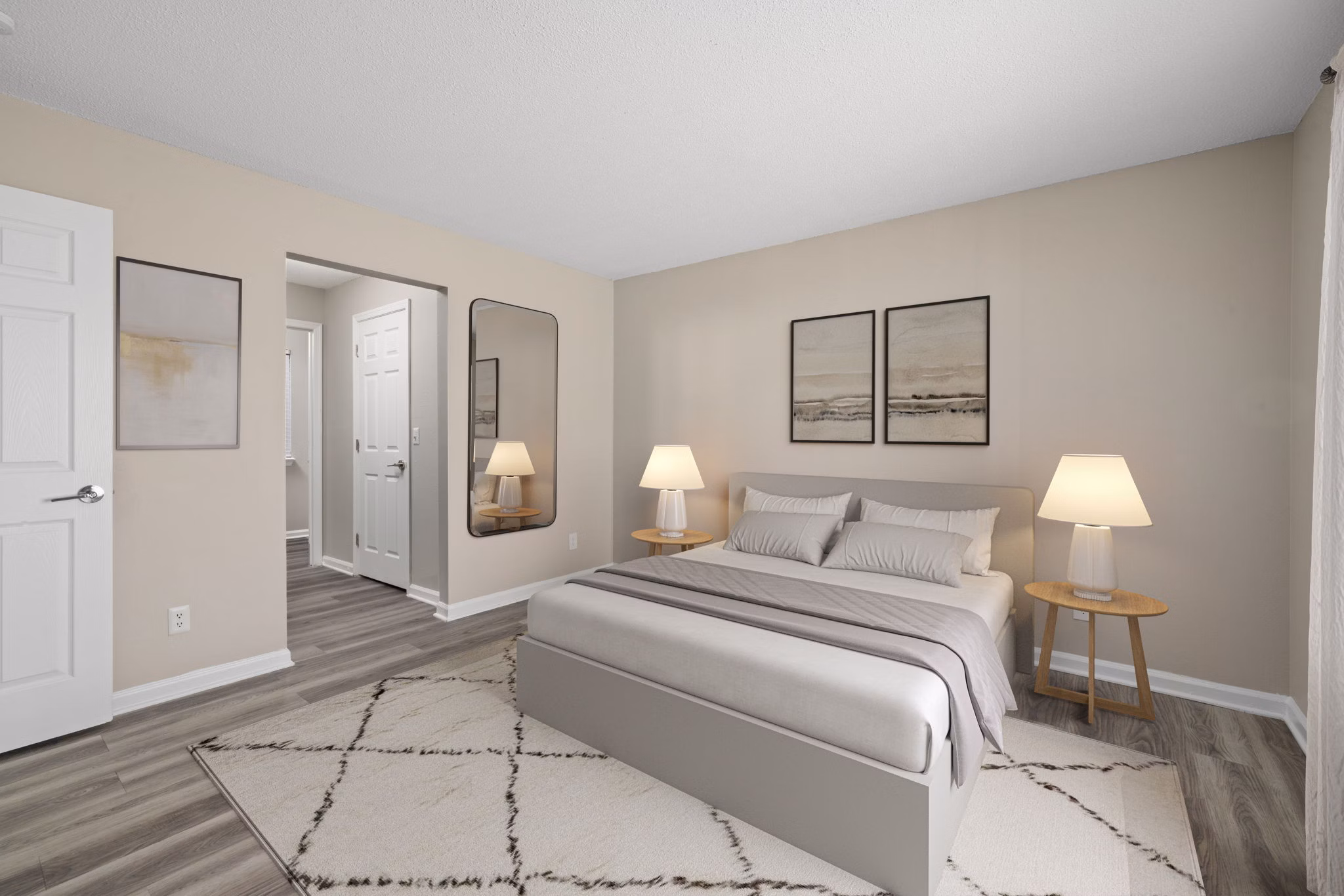 Cozy bedroom with a large window nook at Madison at Adams Farm Apartments