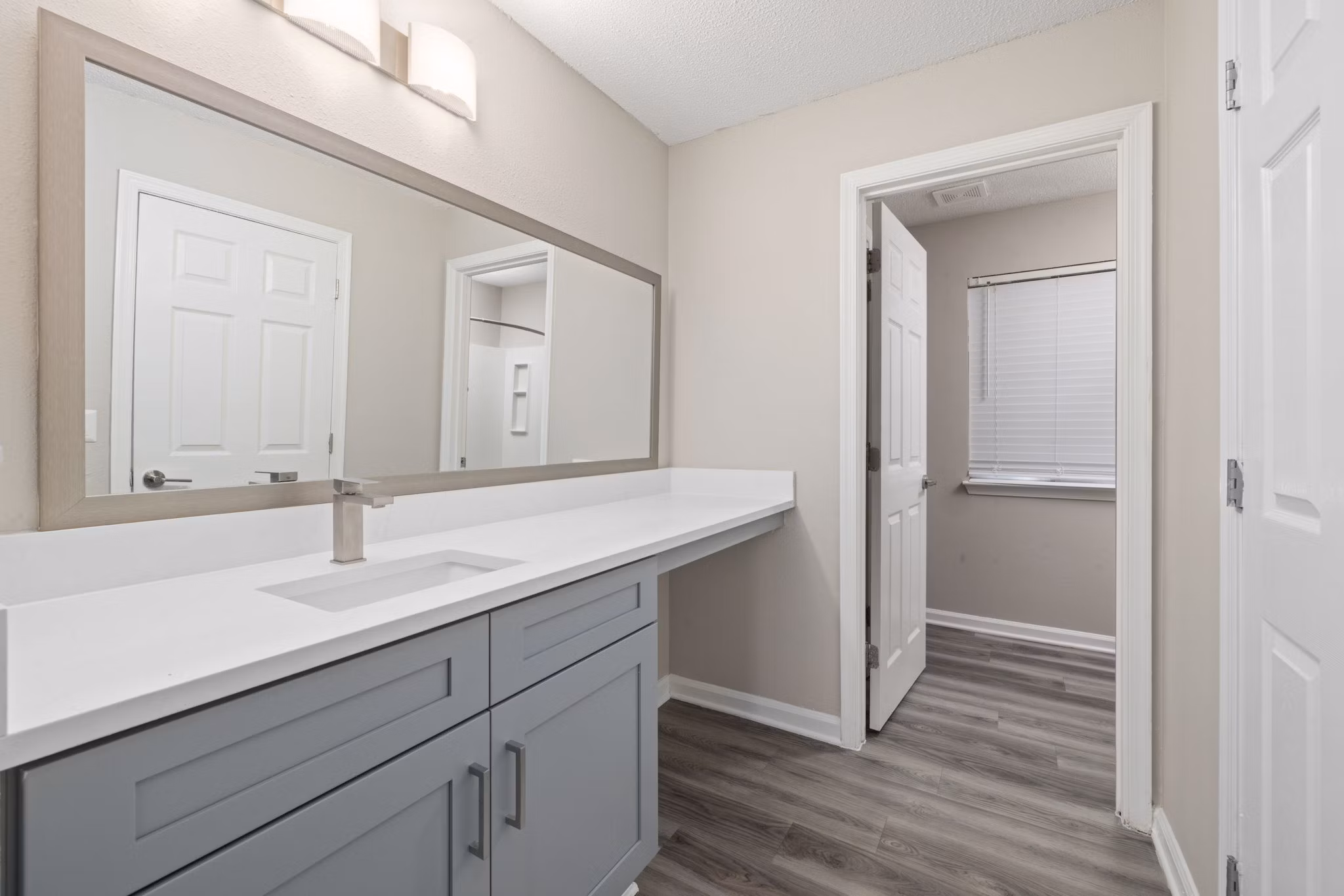 Bathroom featuring sleek fixtures and modern design at Madison at Adams Farm Apartments