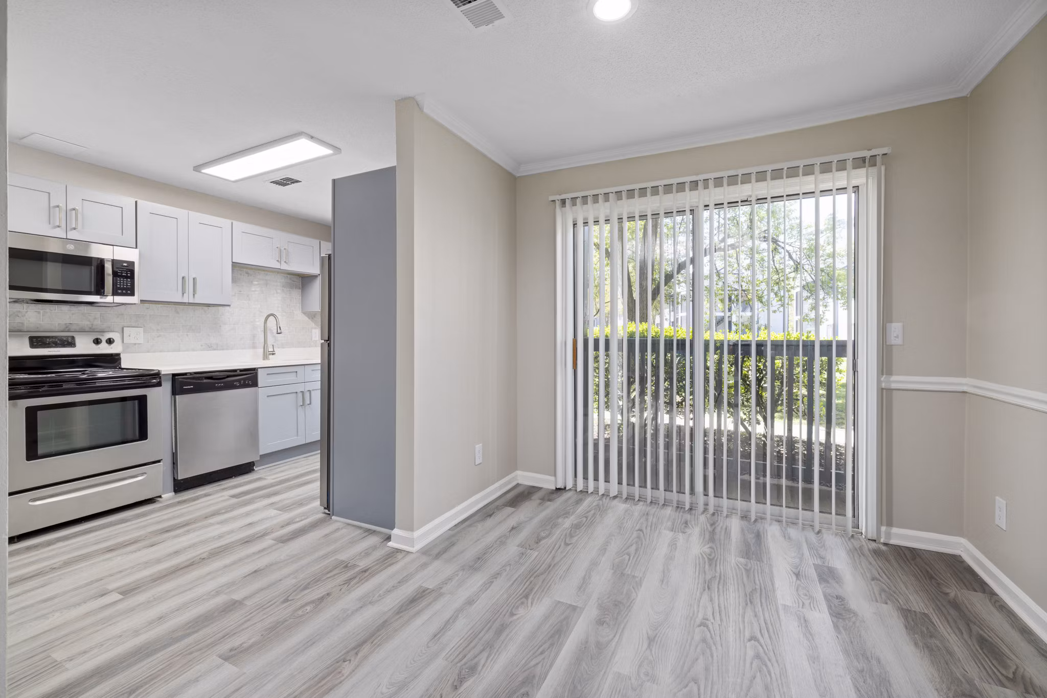 Dining area featuring modern decor and elegant lighting in Madison at Adams Farm Apartments