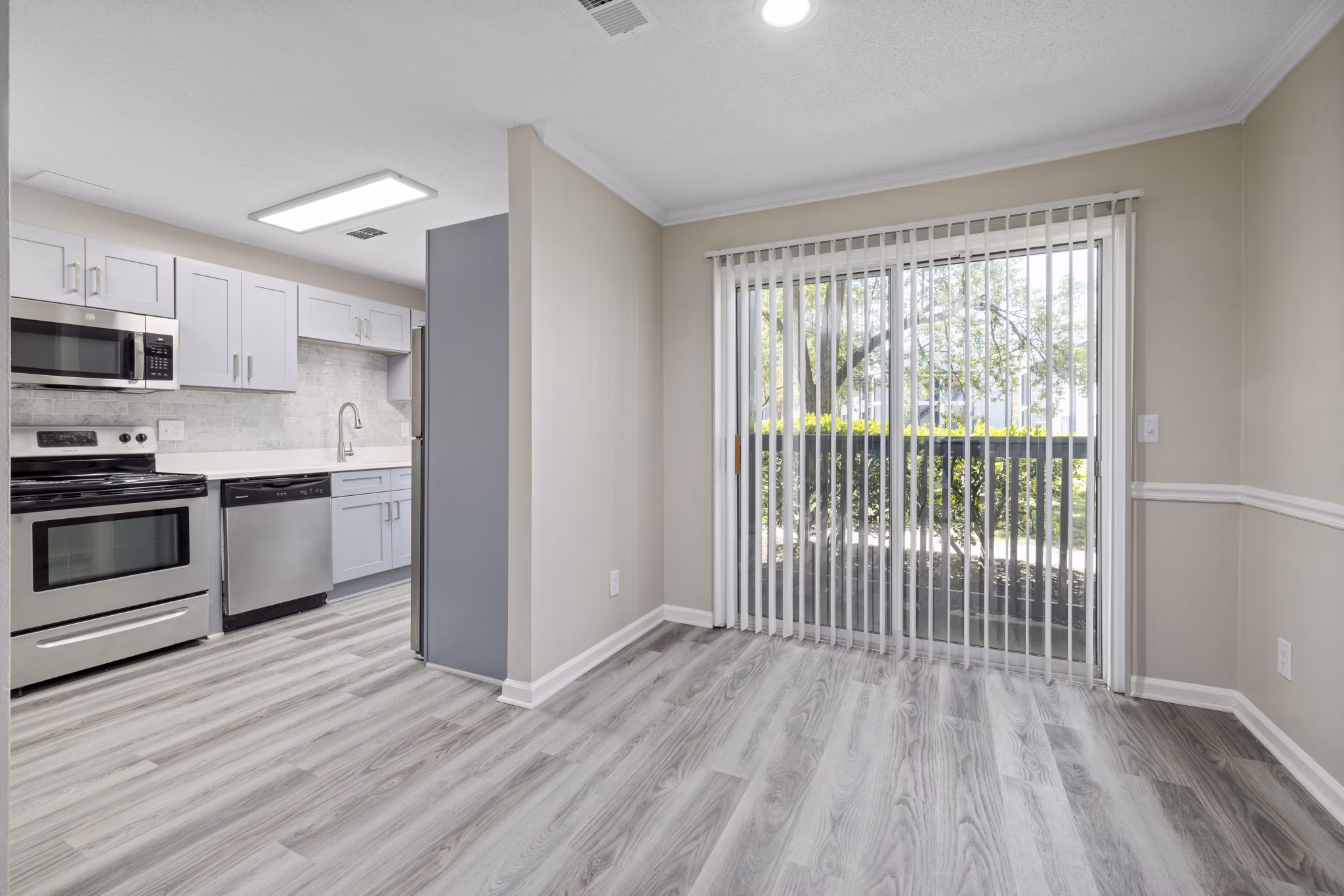 Dining area featuring modern decor and elegant lighting in Madison at Adams Farm Apartments
