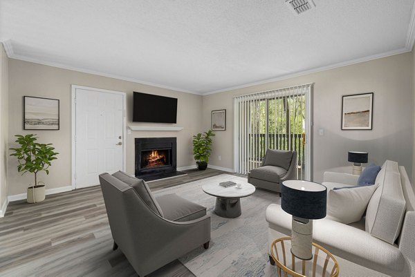 Open-concept living room with modern dÃ©cor at Madison at Adams Farm Apartments, part of Greystar's luxury apartment offerings