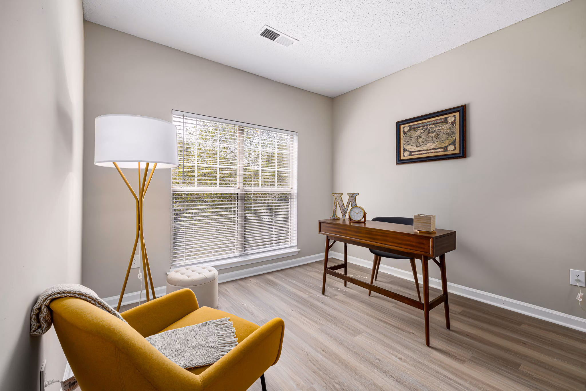 Home office with built-in desk and shelving at Mariners Crossing Apartments