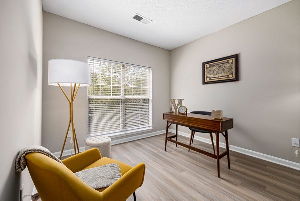 Home office with built-in desk and shelving at Mariners Crossing Apartments