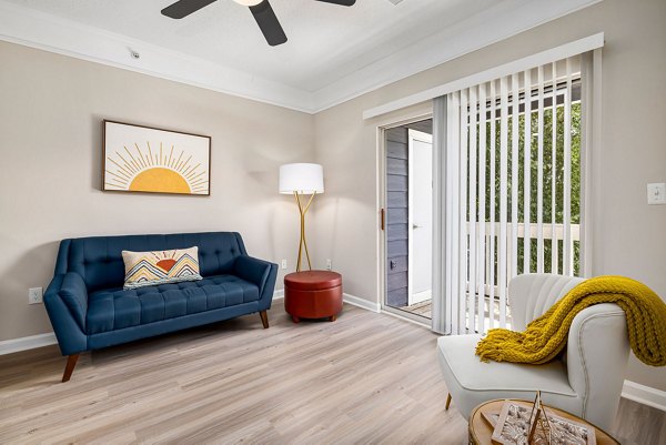Living room with modern furnishings at Mariners Crossing Apartments
