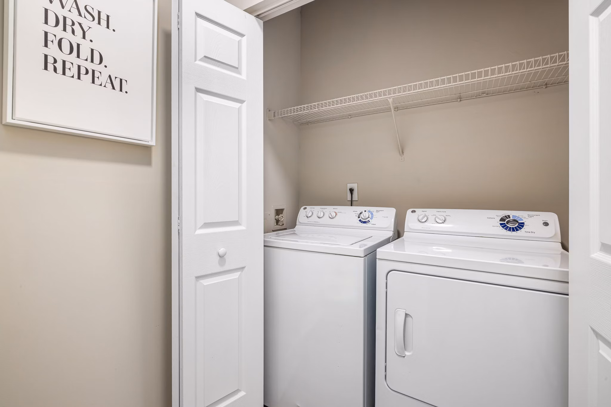 Laundry room with state-of-the-art washers and dryers at Mariners Crossing Apartments