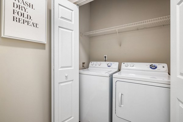 Laundry room with state-of-the-art washers and dryers at Mariners Crossing Apartments