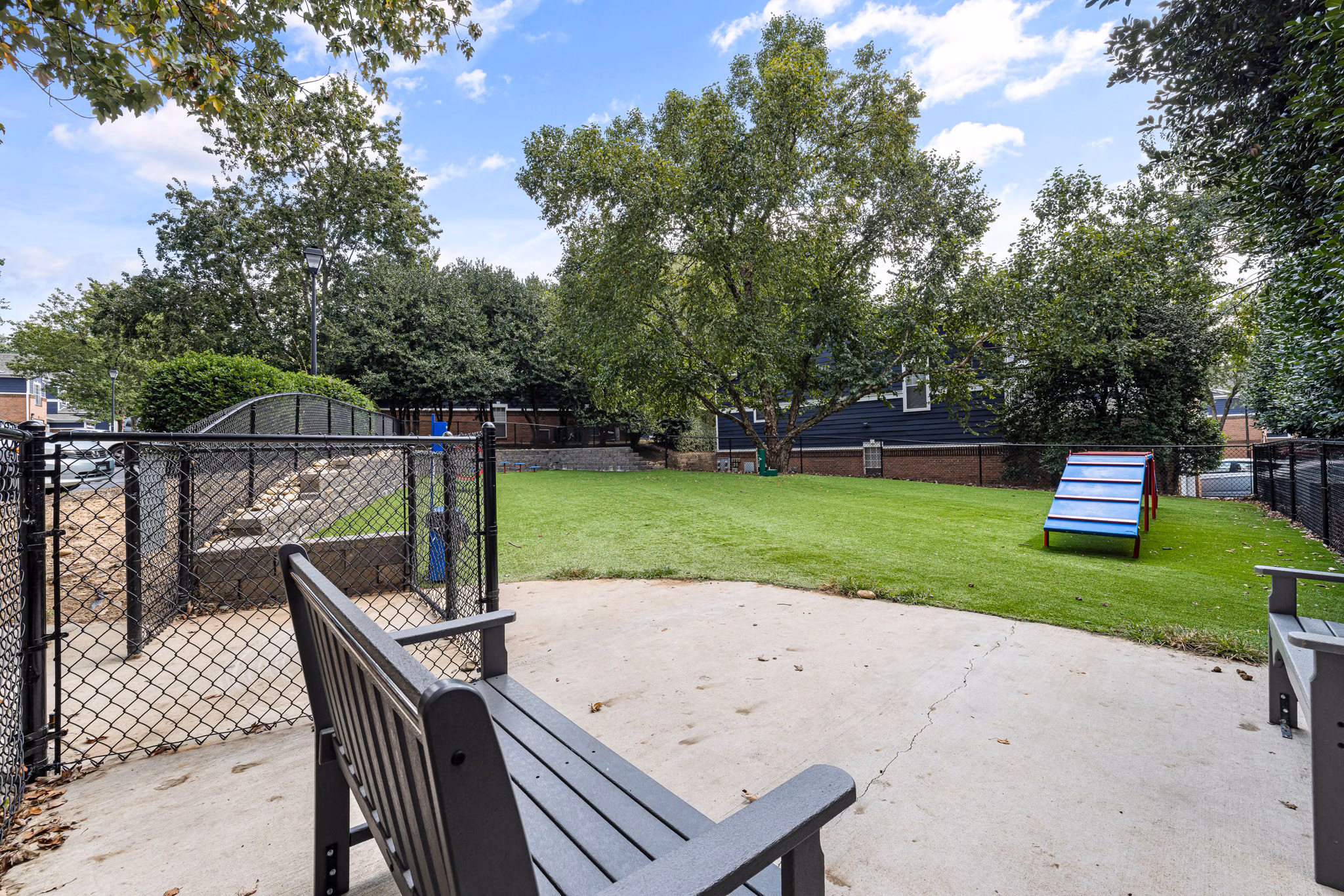 Dog park with agility equipment at Mariners Crossing Apartments