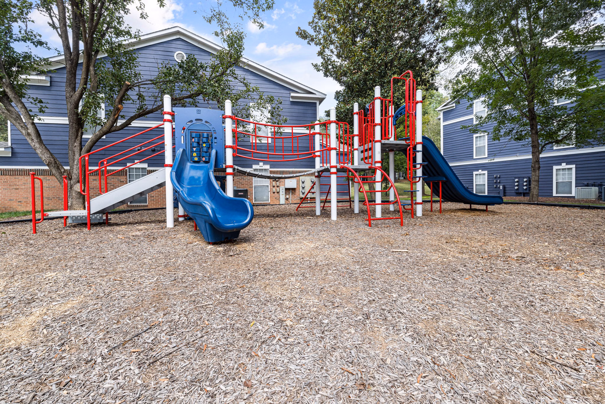 Colorful playground at Mariners Crossing Apartments with modern equipment for family fun and recreation